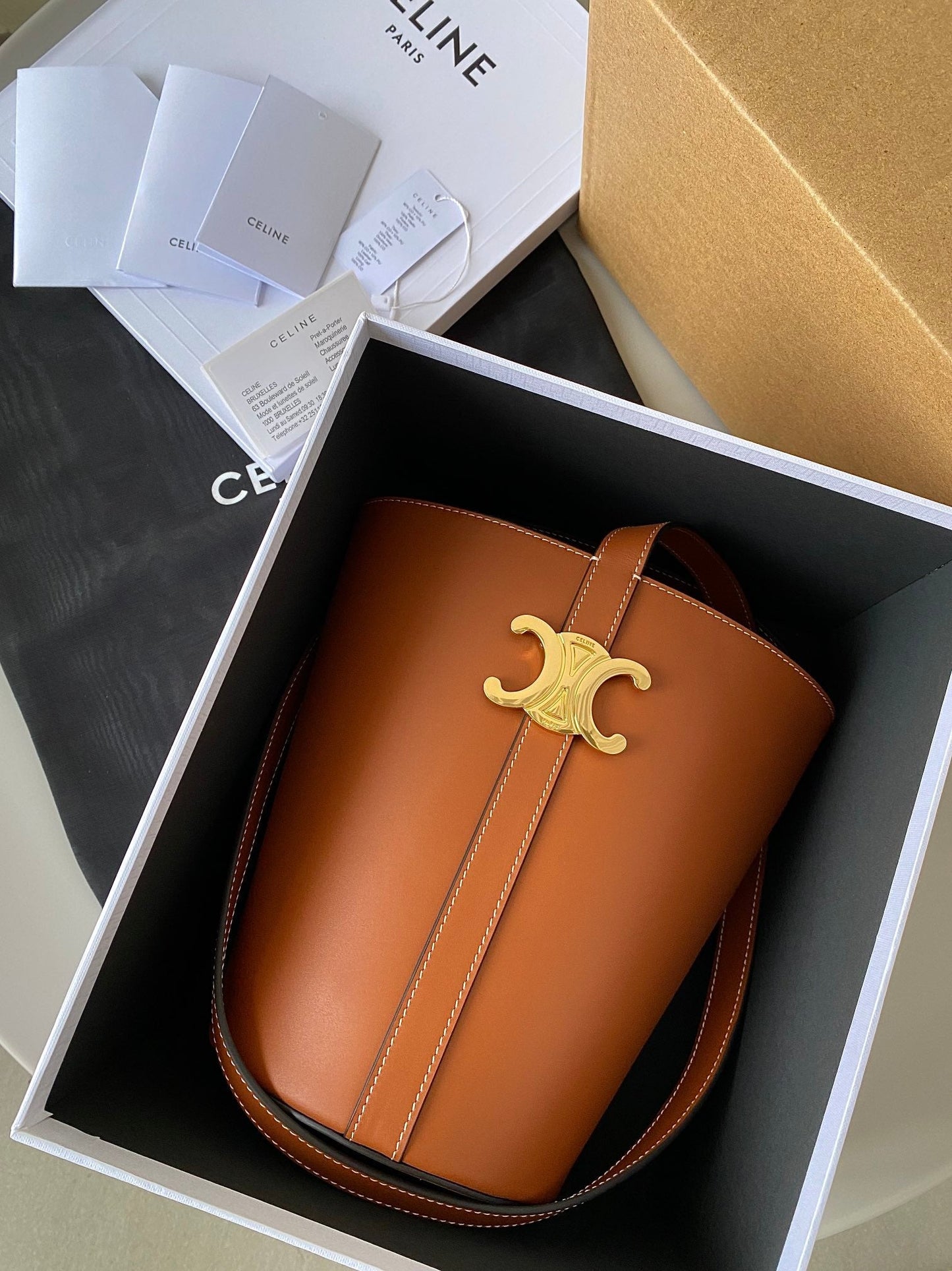 TRIOMPHE 25 BUCKET BAG CINNAMON BROWN CALFSKIN