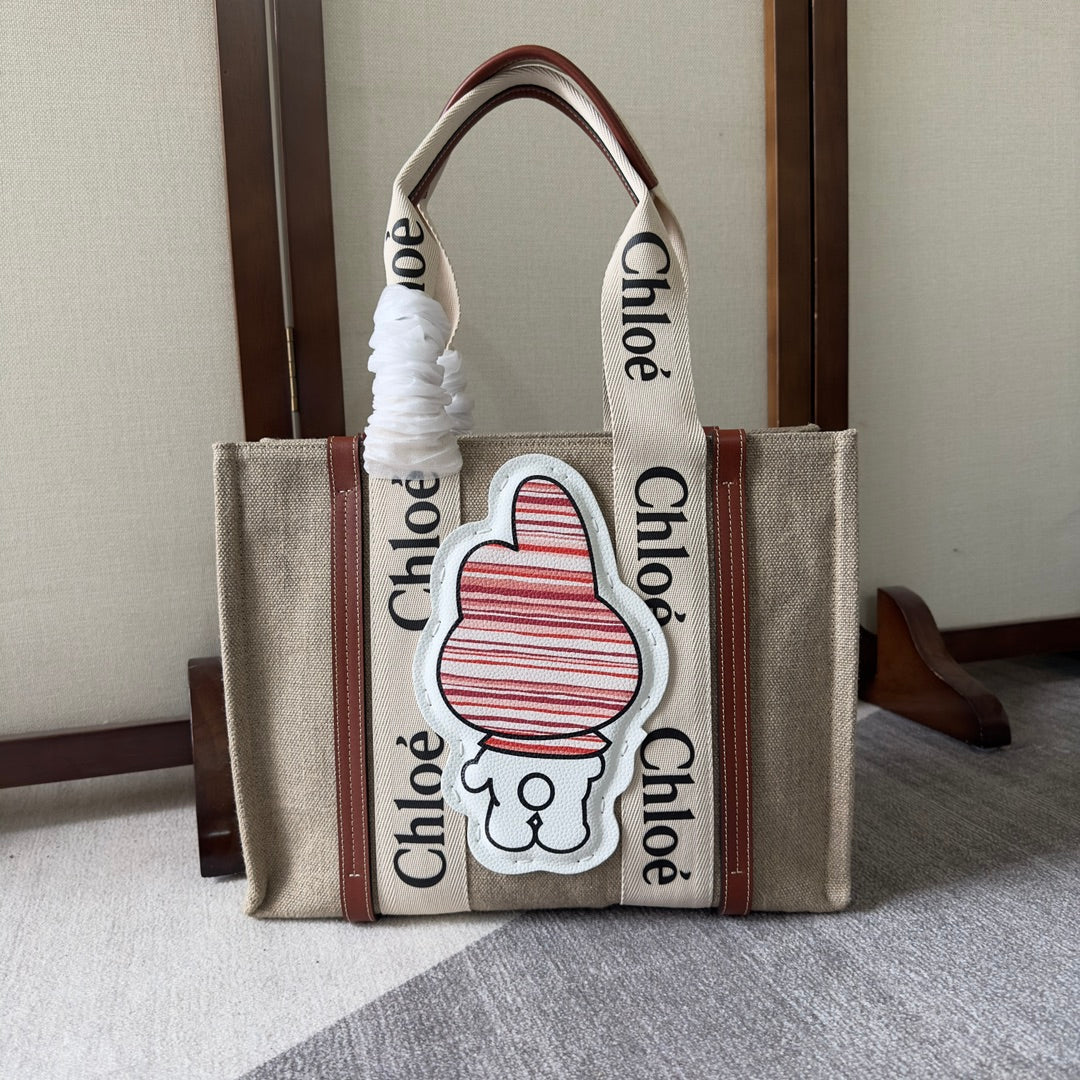 MY MELODY MEDIUM WOODY TOTE BAG 37 IN NATURAL FIBERS BEIGE WEBBING BROWN CALFSKIN