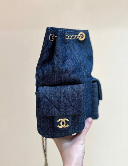 DRAWSTRING BUCKET BACKPACK 24 IN DARK BLUE DENIM GOLD HARDWARE